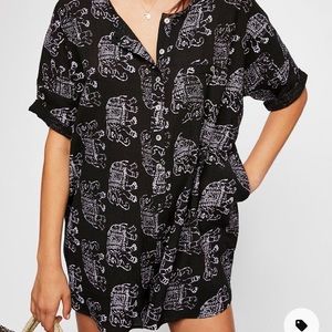 Free People Romper size Med,  color is Black elephants are an off white color